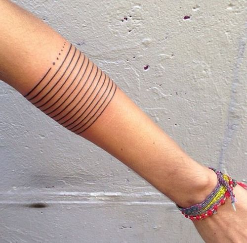 Lines and dots tattoo